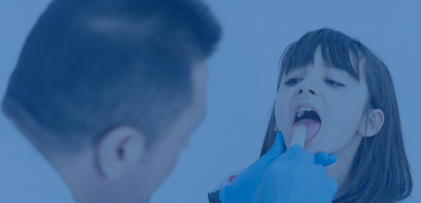male dr looking into young girls mouth - header photo for strep testing page