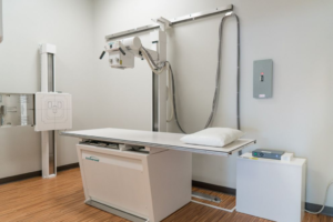 x-ray table and machine in university urgent care