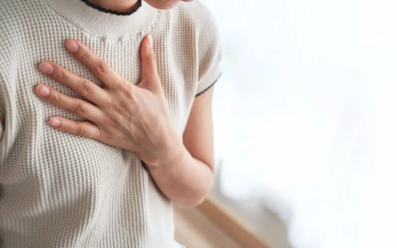 Woman experiencing chest pain